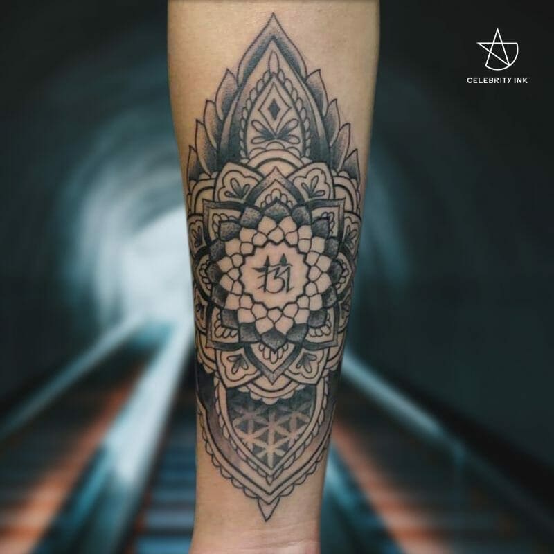 traditional mandala forearm tattoo