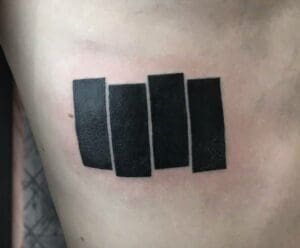 blackout tattoo blackwork tattoo on ribs 